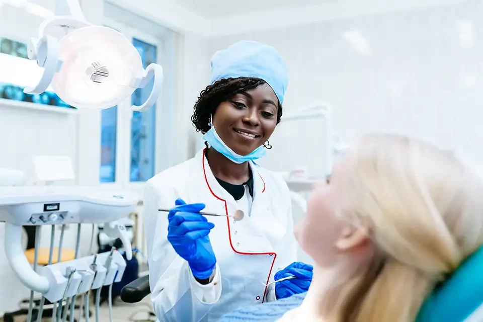 african-american-female-dentist-treating-patient How Often Should You Visit Dentist if You Have Gum Disease?